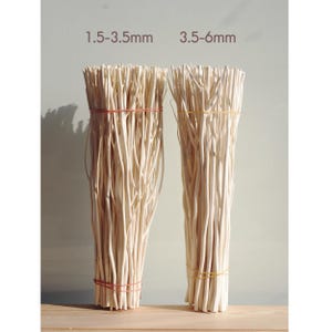 May include: Two bundles of white bleached natural twigs, tied with rubber bands. The bundle on the left is labelled "1.5-3.5mm" and the bundle on the right is labelled "3.5-6mm".