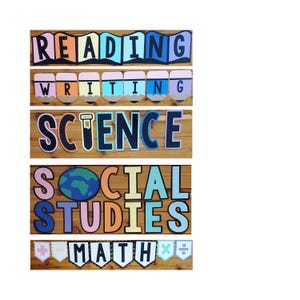May include: Colorful classroom decor featuring the words "READING", "WRITING", "SCIENCE", "SOCIAL STUDIES", and "MATH". Each word is in a different color and style, with a wooden background. The "WRITING" banner has pencil illustrations.
