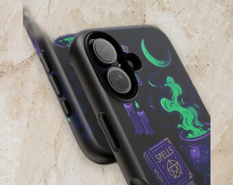 May include: A black smartphone case featuring a graphic print of a purple spellbook with the word SPELLS, a bubbling green cauldron, melting purple candles, and a crescent moon. The case has cutouts for the dual camera lenses and side buttons.