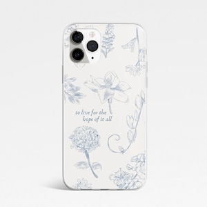 May include: A phone case with a floral pattern in blue on a cream background. The case displays various flower illustrations and the text "to live for the hope of it all". The case has a glossy finish and a camera cutout.