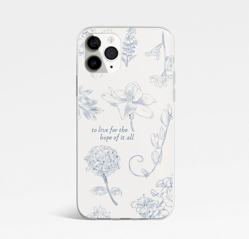 May include: A phone case with a floral pattern in blue on a cream background. The case displays various flower illustrations and the text "to live for the hope of it all". The case has a glossy finish and a camera cutout.
