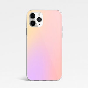 May include: A clear phone case with a gradient design that transitions from light pink to yellow. The case has a cutout for the camera lens.