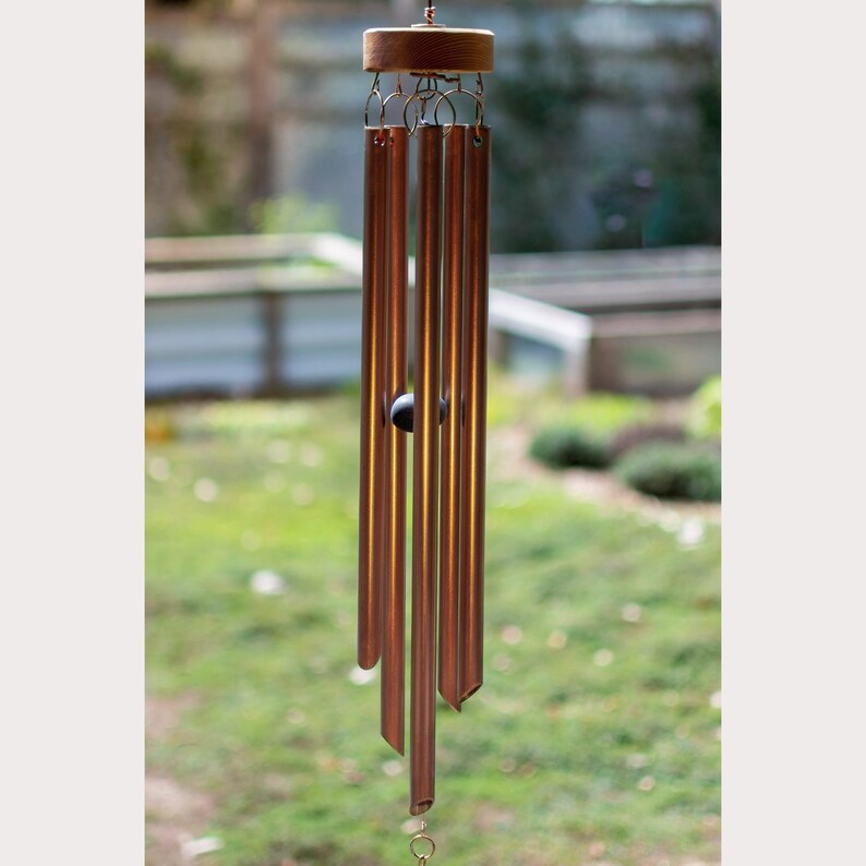 five handcrafted copper chimes.