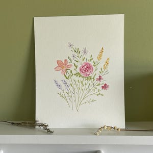 May include: Watercolor painting of a bouquet of pink, yellow, and purple flowers on a white background.