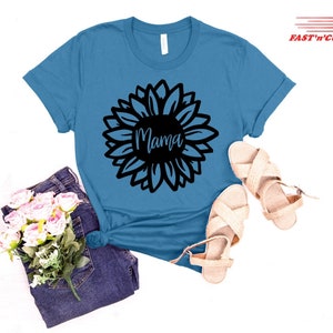 a t - shirt with a flower and a pair of sandals