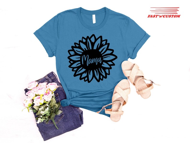 a t - shirt with a flower and a pair of sandals