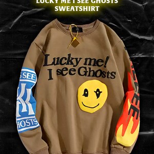 Y2K streetwear meets hip-hop vibes with this Kanye West-inspired 'Lucky Me I See Ghost'
sweatshirt. Loose fit, oversized pullover, cotton fabric, 3D print. Perfect for Kanye fans of all
sizes.