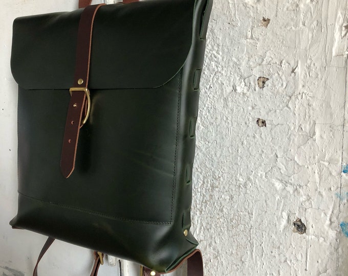 Racing green convertible rucksack.