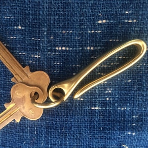 Antiqued Copper Japanese Fishhook keychain with Bison leather and copper  post and burr rivet.