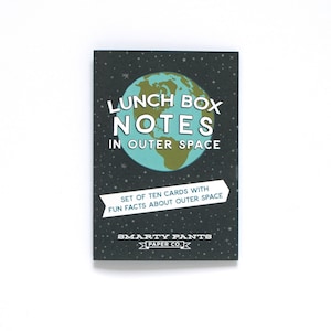 May include: A set of ten lunch box notes with fun facts about outer space. The cards feature a teal and brown globe graphic with the words "LUNCH BOX NOTES IN OUTER SPACE" in white. The background is dark gray with white stars. The brand name is "SMARTY PANTS PAPER CO."
