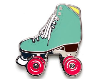Sea Foam roller skate pin with glow in the dark wheels