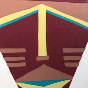 May include: Abstract geometric art print with a stylized face in shades of brown, yellow, and teal.