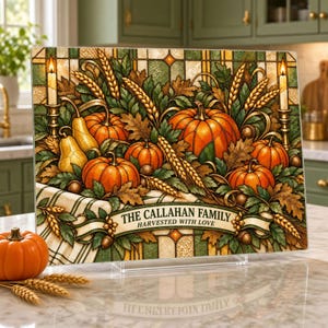 May include: A rectangular glass cutting board featuring a stained-glass style autumn harvest scene with pumpkins, pears, wheat stalks, and candles. A banner across the bottom displays the text THE CALLAHAN FAMILY HARVESTED WITH LOVE.