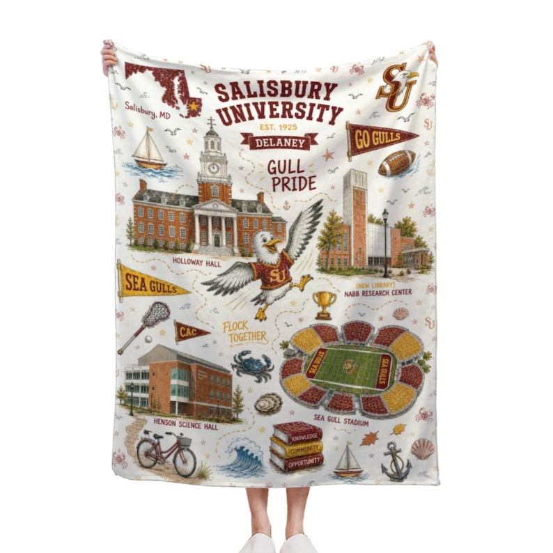 May include: White blanket featuring a map of Salisbury University with illustrations of campus buildings, a seagull mascot, and the text "Salisbury University" and "Go Gulls". The blanket includes a map of Salisbury, MD.