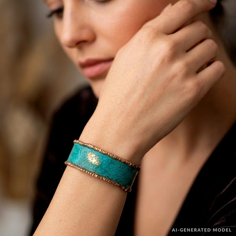 A close-up of a woman's face wearing a turquoise and gold bracelet on her wrist.
