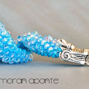 Bracelet in aqua glass and a silver toned dragon clasp image 1