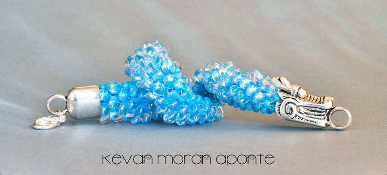 Bracelet in aqua glass and a silver toned dragon clasp image 1