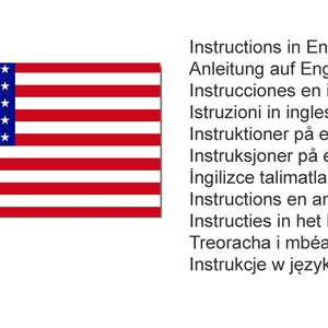 May include: The American flag, featuring a blue canton with white stars and red and white stripes, is displayed. Accompanying text lists instructions in multiple languages, including English, German, Spanish, and Italian.