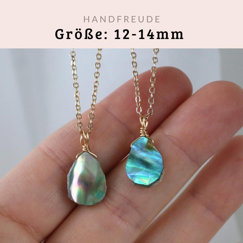 May include: Two gold necklaces with iridescent green abalone shell pendants. The pendants are approximately 12-14mm in size.  HANDFREUDE is written in the top left corner of the image.  Gr&ouml;Be: 12-14mm is written in the centre of the image.