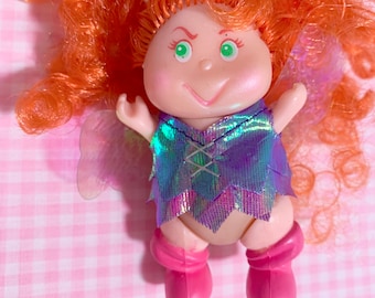 vintage 1980s kitschy cute pastel girly nostalgia toy Blinkins - Shady orange curly fairy alien doll