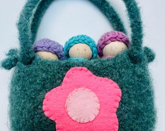 wood peg dolls in wool pouch