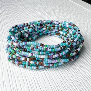 Seed Bead Bracelet Bohemian Style Glass Beads Stretch Elastic Band Colorful Design Santa Fe Inspired Jewelry Handmade Accessory Stackable Collection Boho Fashion Statement Southwestern Style Native American Influence Daily Wear Piece