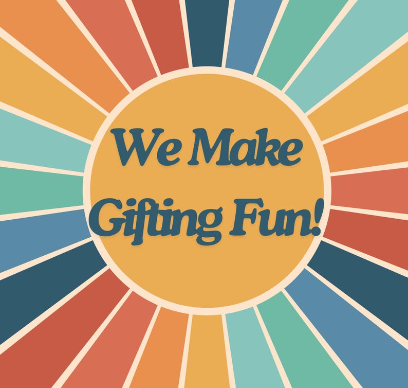May include: A graphic design featuring a central mustard yellow circle with the dark blue text "We Make Gifting Fun!" surrounded by radiating sunburst stripes in alternating colors of light blue, teal, orange, red, and yellow.