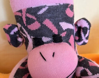 October is Breast Cancer awareness pink ribbon sock monkey. Part of proceeds to charity