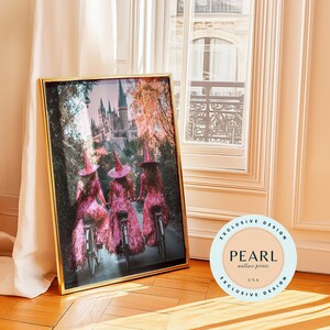May include: Three women dressed as witches in pink sequined dresses ride bicycles down a path towards a castle in the distance. The image is framed in gold.