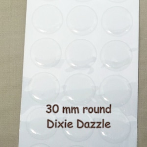 May include: A sheet of 30 mm round clear adhesive stickers, labeled "Dixie Dazzle".