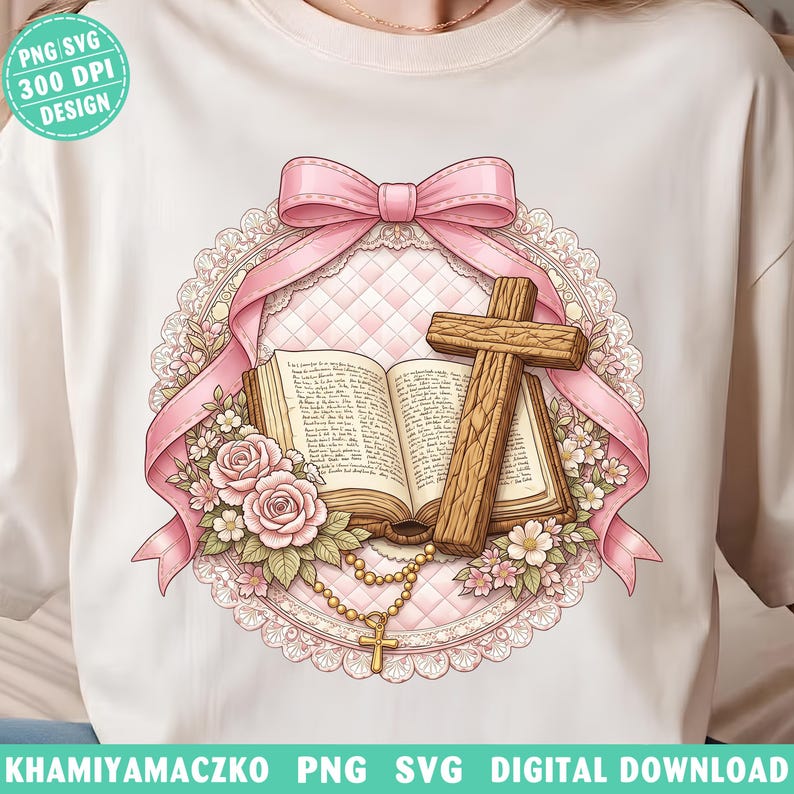 May include: White t-shirt featuring a religious design. The design includes an open book, a wooden cross, pink roses, and a rosary. A pink ribbon and lace frame the central elements. The text "PNG SVG 300 DPI DESIGN" is in the upper left corner.