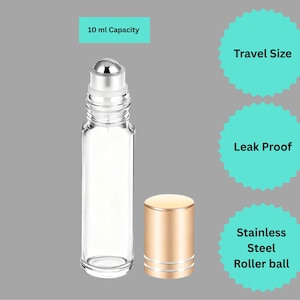 May include: A clear glass roller bottle with a stainless steel roller ball and a gold-colored cap. The bottle has a 10 ml capacity and is labeled as travel size and leak proof.