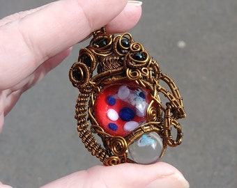 Borosilicate Spotted Opal Necklace, Attitude Pendant, Woven Wire Wrapped Vintage Bronze Wrap, Red Blue White. Opal Jewelry