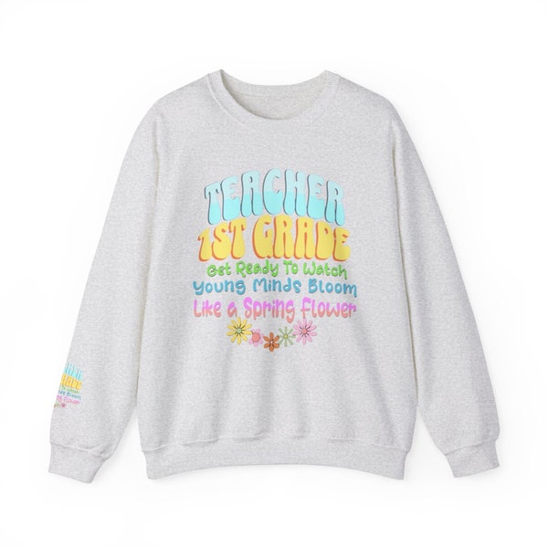Teacher 1st Grade Sleeve and front print. Get Ready to Watch Young Minds Bloom Like A Spring Flower. Unisex Heavy Blend™ Crewneck Sweatshirt