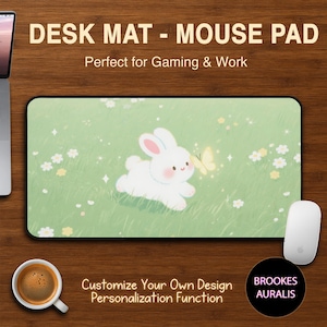May include: A rectangular desk mat featuring a white bunny and butterfly on a green field design. Text on the mat reads "DESK MAT - MOUSE PAD" and "Customize Your Own Design". A white mouse and coffee cup are also visible.