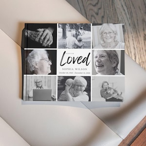 Op de afbeelding: Een zwart-wit fotoalbum met een collage van afbeeldingen. De omslag toont het woord "Loved" in script, samen met een naam en data. Het album wordt gepresenteerd op een licht oppervlak.