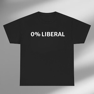 May include: Black t-shirt with the text "0% LIBERAL" printed in white. The shirt has a crew neck and short sleeves. The text is centered on the front of the shirt.