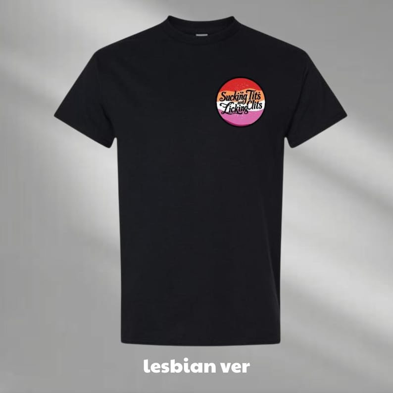 a black t - shirt with a pink, yellow, and orange logo