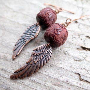 Wing and a Prayer Earrings Natural Carved Blackwood Om Mani Padme Hum Beads Copper Wing Earrings Angel Wing and Om Earrings Under 25 image 1