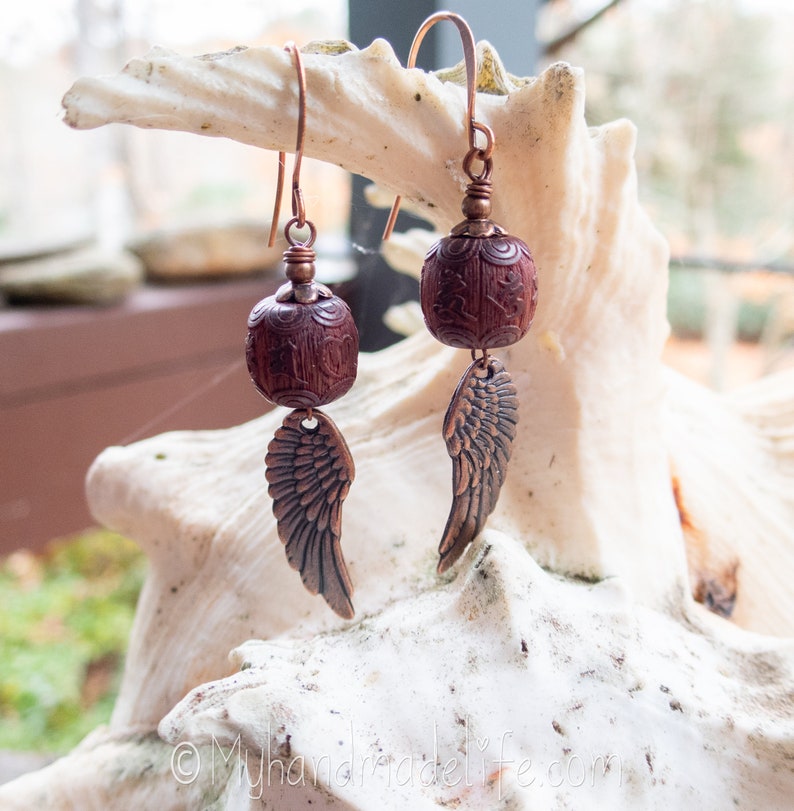 Wing and a Prayer Earrings Natural Carved Blackwood Om Mani Padme Hum Beads Copper Wing Earrings Angel Wing and Om Earrings Under 25 image 10