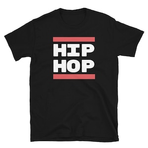 May include: Black t-shirt featuring the white text "HIP HOP" in a bold font, set between two red horizontal lines. The tee shirt is made of a soft material and has short sleeves.