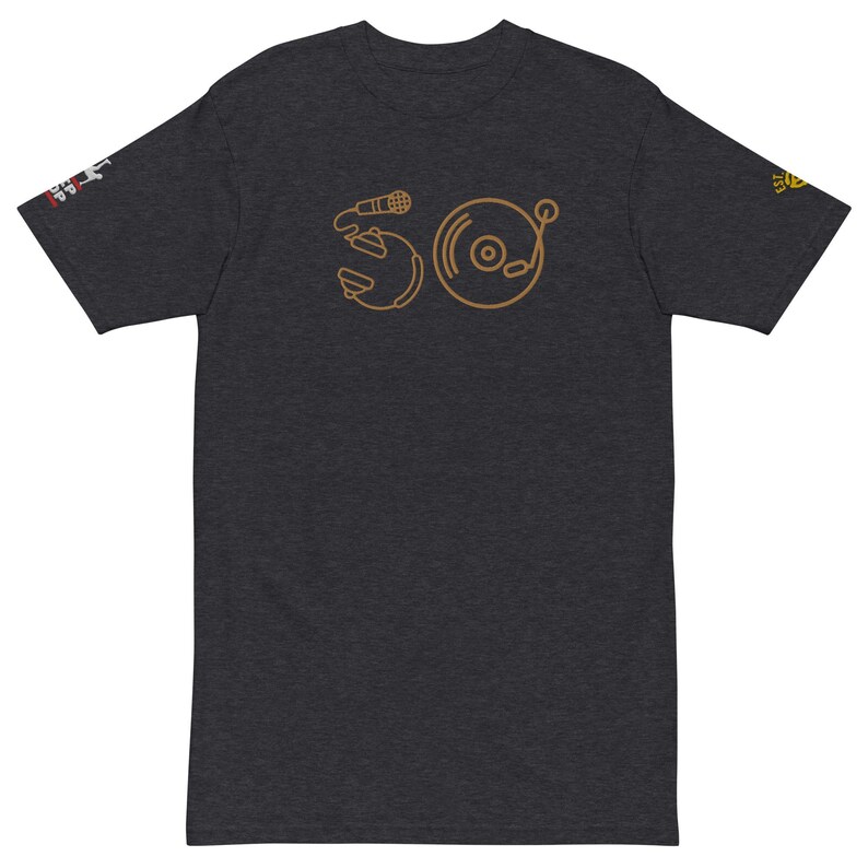 May include: A dark heather grey t-shirt with a gold outline of a microphone and a record player. The design is a stylized representation of the number 50.