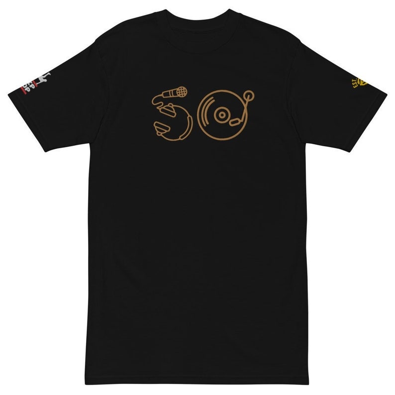 May include: Black t-shirt with a brown outline of a microphone and a record player on the front.