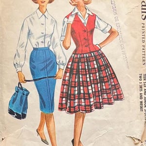May include: A vintage sewing pattern envelope featuring illustrations of two outfits. One shows a white long-sleeve shirt, a blue pencil skirt, and a blue handbag. The other shows a white short-sleeve shirt, a red vest, and a red plaid skirt.