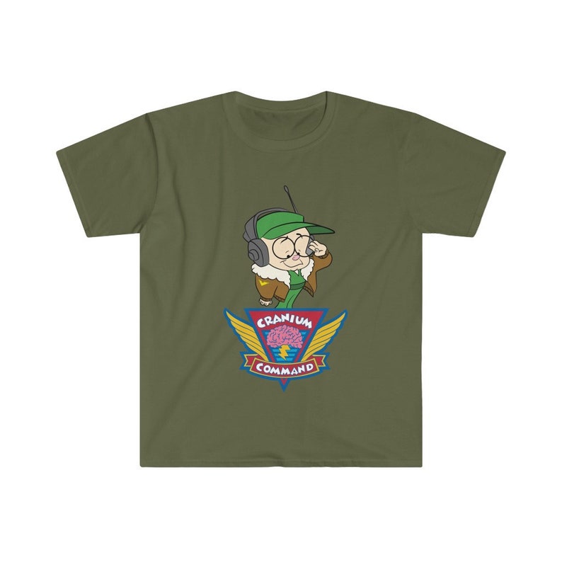 May include: An olive green t-shirt with a cartoon character wearing a green cap and headset. The design includes the words "Cranium Command" and a brain graphic with wings. The text "Cranium Command" is displayed below the brain graphic.