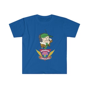 May include: Royal blue t-shirt with a cartoon character wearing a green cap and aviator jacket, with a radio headset. Below the character is a crest with a brain graphic and the words "Cranium Command".