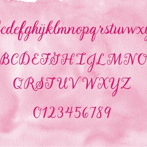 May include: A digital alphabet and number set displayed in a dark pink cursive script font. The characters include lowercase letters a through z, uppercase letters A through Z, and digits 0 through 9, all set against a light pink watercolor background.