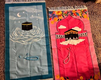Prayer mat with masbaha and zakat box