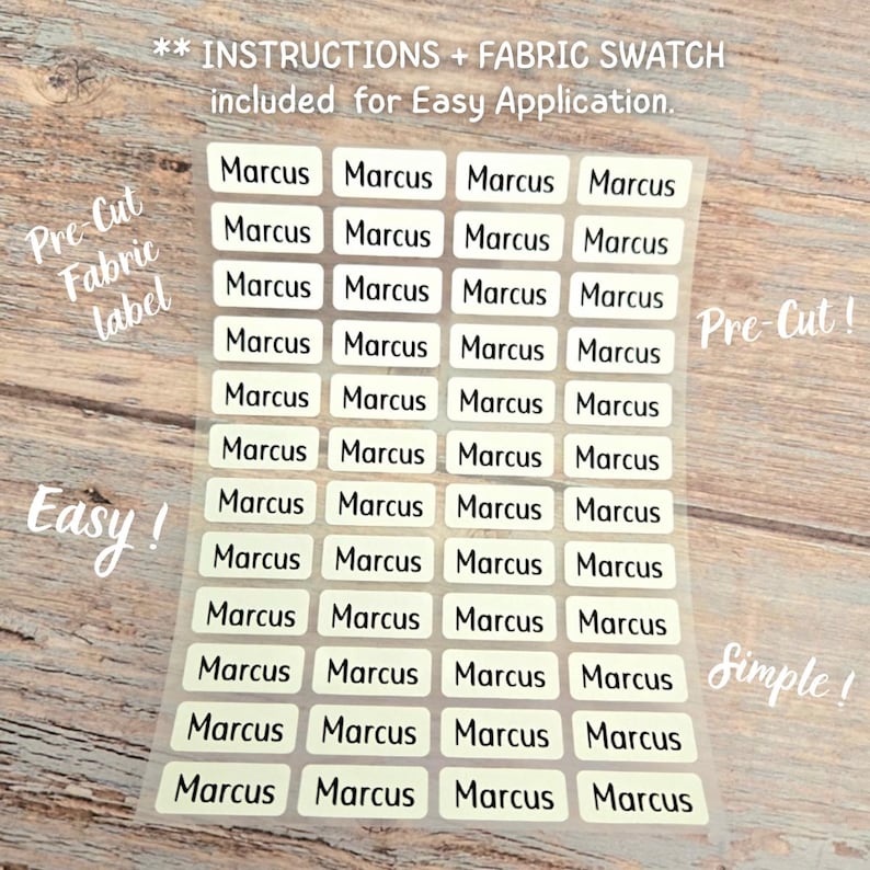 May include: A sheet of rectangular, off-white fabric labels, each printed with the name Marcus in a black sans-serif font. The sheet contains forty-eight pre-cut labels arranged in four columns and twelve rows, with text stating instructions and fabric swatch included for easy application.