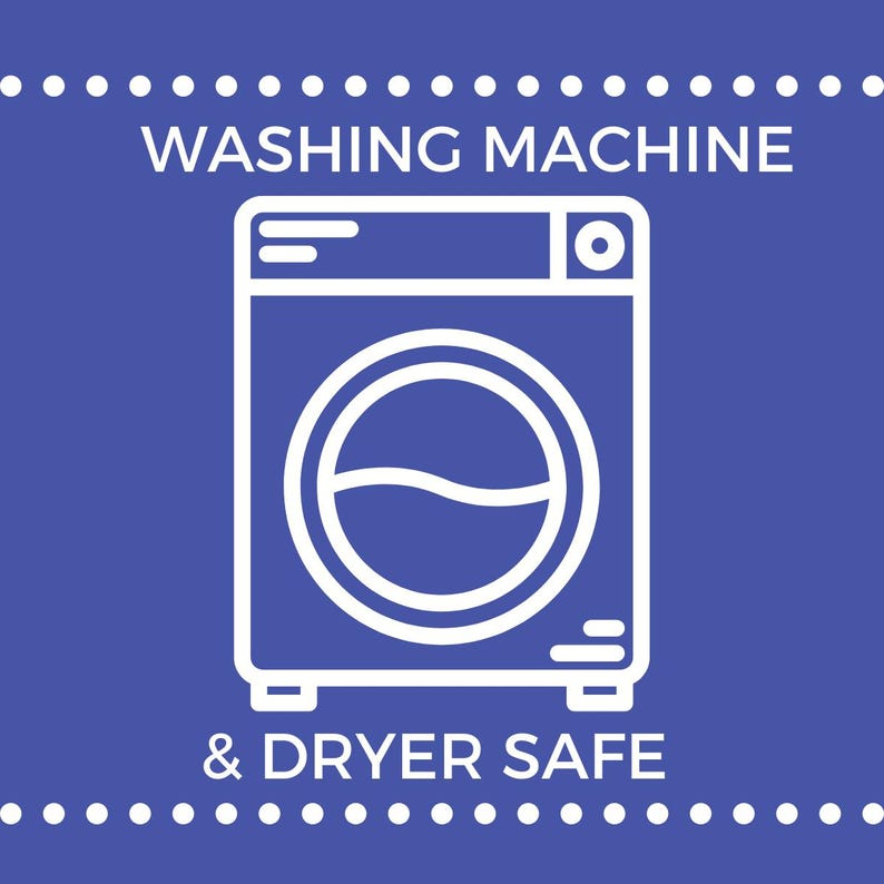 May include: A square purple graphic featuring a white line-art icon of a front-loading washing machine. The text WASHING MACHINE is centered above the icon, and the text & DRYER SAFE is centered below it, framed by horizontal dotted lines.